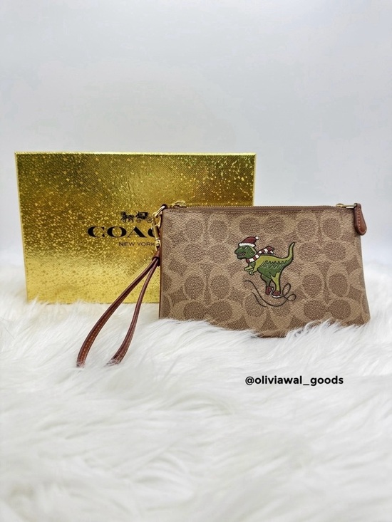 Coach Handbags - ❌❌SOLD ❌❌EUC Coach Signature Canvas Wristlet with Holiday Rexy Patch